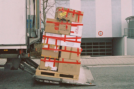Boxes are loading in the truck.